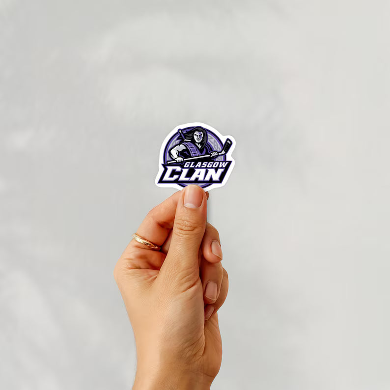 Holding a sticker of glasgow clan ice hockey team logo on a white background
