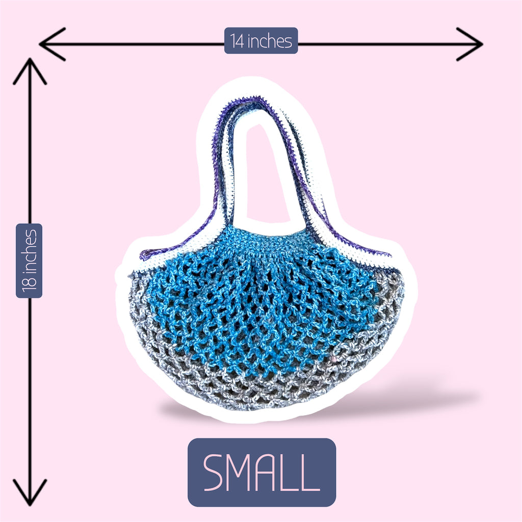 Crochet mesh market bag in blue grey white and purple gradients on a light pink background with width and length sizing shown