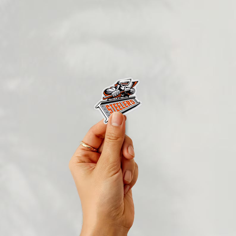 Holding a sticker of sheffield steelers ice hockey team logo on a white background
